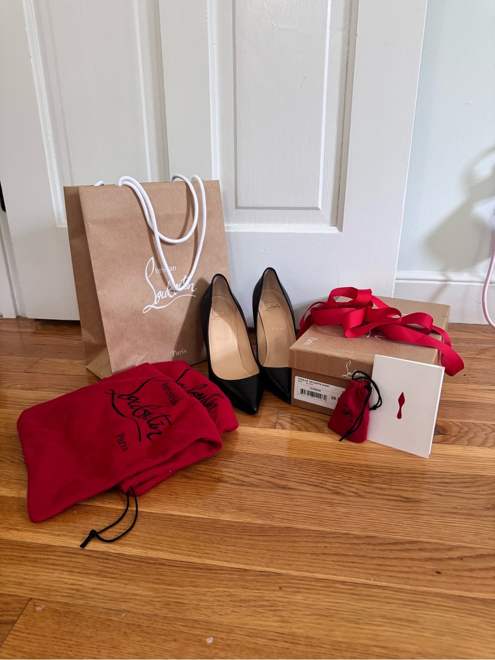 Christian Louboutin Black Pointed Leather Pumps with Signature Red Accents